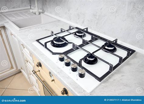 Modern White Gas Stove on Counter Top Closeup. Hob Gas Stove Made of ...