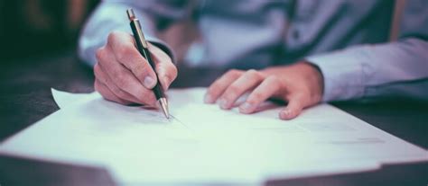 closeup   hand signing  document premium ai generated image