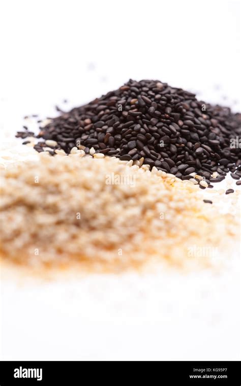 Two Piles Of Sesame Seed Black In Focus But White Out Stock Photo Alamy