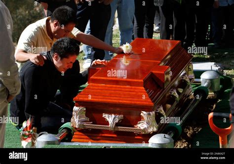 Family members mourn in front of a coffin containing the remains of Eva Melchor, a victim of the ...