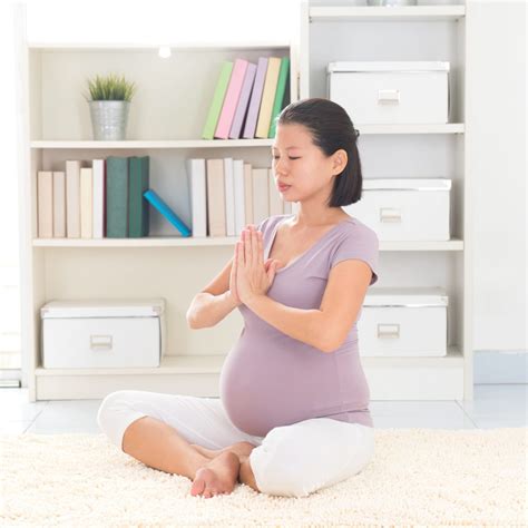 Pregnant Woman Doing Yoga The Yinova Center