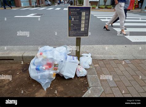 Recycling Next To A Sign That Tells Which Recycling Is Picked Up When