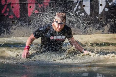 Spartan Race Runners Wade Through Mud And Leap Through Fire In Tough