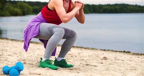 Woman Squatting Legs And Buttocks Workout Close Up Outdoor Fitness