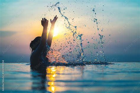 Black Silhouette Of Asian Woman Splash Water On Summer Vacation Holiday