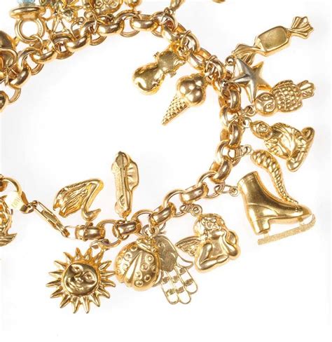 9ct Gold Charm Bracelet With 27 Assorted Charms