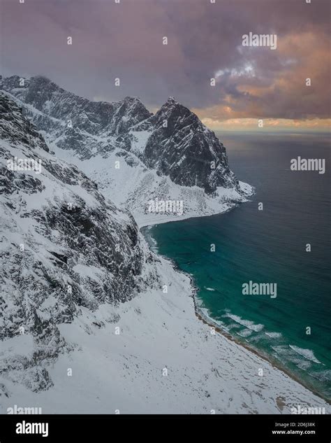 Aerial View Kvalvika Beach In Winter With Snow Ryten Mountain Tops