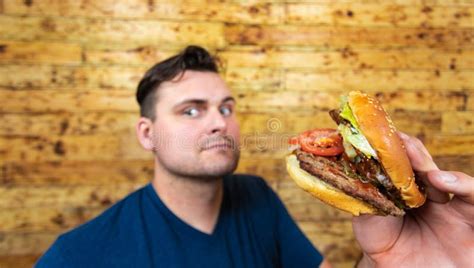 Happy Man with His Fast Food Burger. Not so Much Healthy Life Style, but Whatever Stock Photo ...