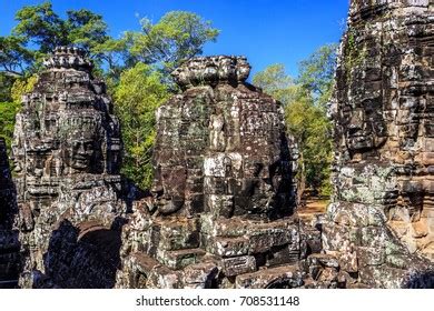 Giant Stone Faces Ancient Buddhist Khmer Stock Photo