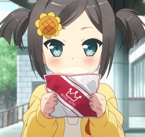 An Anime Character Holding Up A Box With Food In Her Hand And Looking