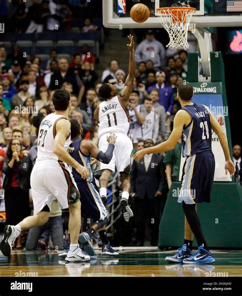 Milwaukee Bucks Brandon Knight 11 Is Fouled As He Puts Up A Shot In