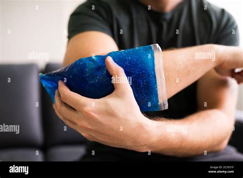 Man Applying Ice Pack Injured Hi Res Stock Photography And Images Alamy