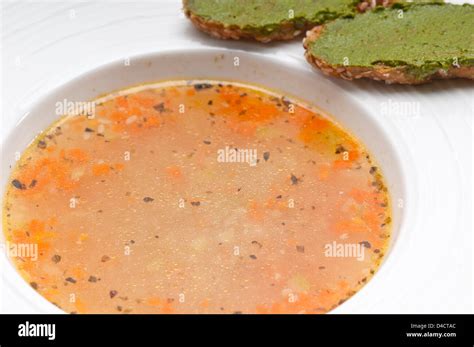 Classic Italian Minestrone Passato Soup With Pesto Crostini On Side