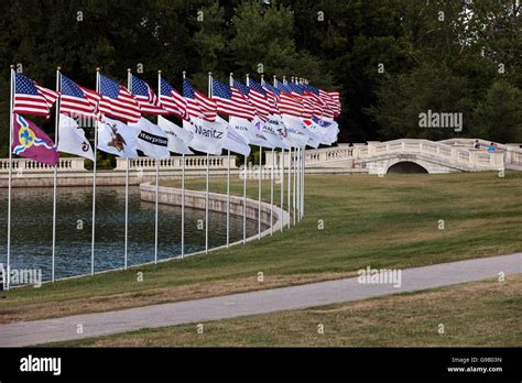 Row Of American Flags Waving In The Wind Located In Forest Park St