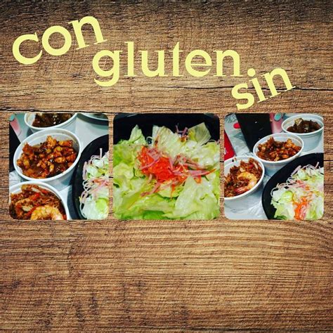 A Wooden Table Topped With Bowls Filled With Different Types Of Food Next To A Sign That Says