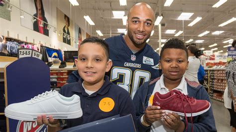 Chargers Hold Annual Shoe and Backpack Distribution