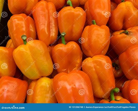 Orange Bell Peppers on a Counter in the Supermarket Stock Photo - Image ...