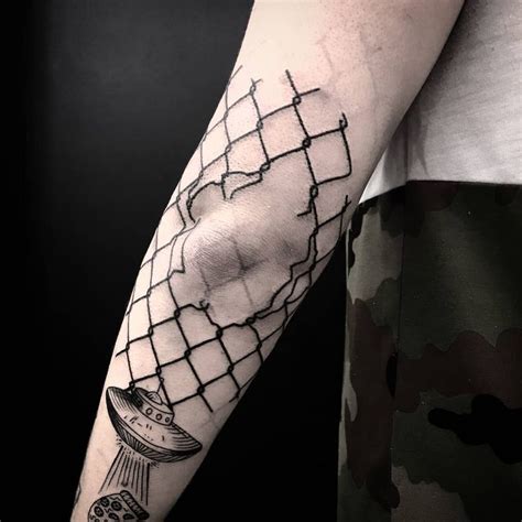 Broken Fence Inked Around The Left Elbow By Tattooist Gvsxrt Cool Arm