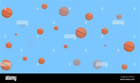 Composition Of Multiple Basketballs Over Blue Background Stock Photo