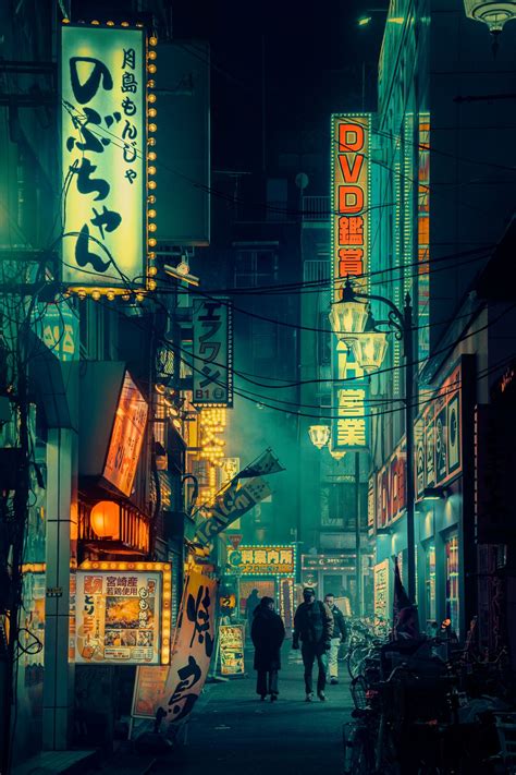 Sleepless City Streets Of Rainy Tokyo Nights Lit By Electric Neon Signs