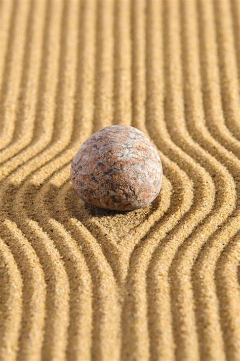 Japanese Zen Garden With Yin Yang Stone In Textured Sand Stock Image