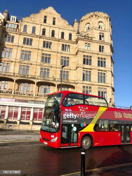 red bus side view   premium high res pictures getty images