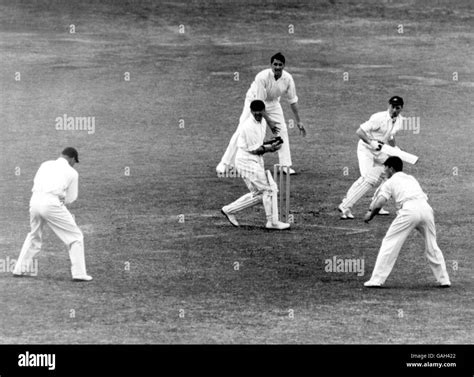 England's Wally Hammond (l) takes a catch at first slip to dismiss ...