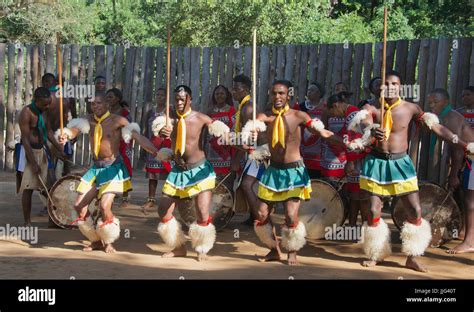 Four men performing traditional dance Mantenga Cultural Village ...