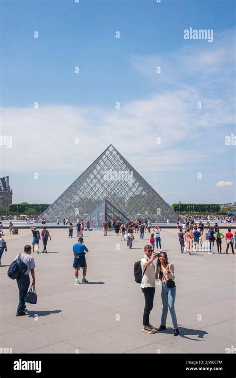 The famous pyramid entrance to Le Louvre Stock Photo - Alamy