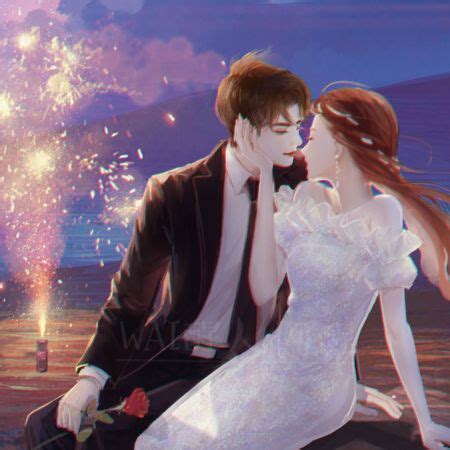 A Man And Woman Sitting Next To Each Other With Fireworks In The Sky