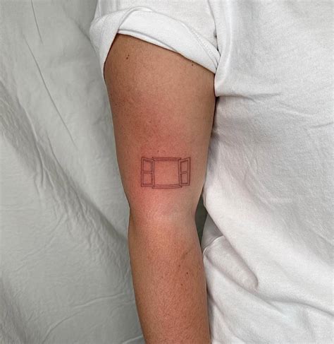 FIne Line Window Tattoo Placed On The Upper Arm