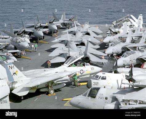 Flight Deck Personnel Respot Aircraft Near The Bow Of The Nuclear Powered Aircraft Carrier Uss