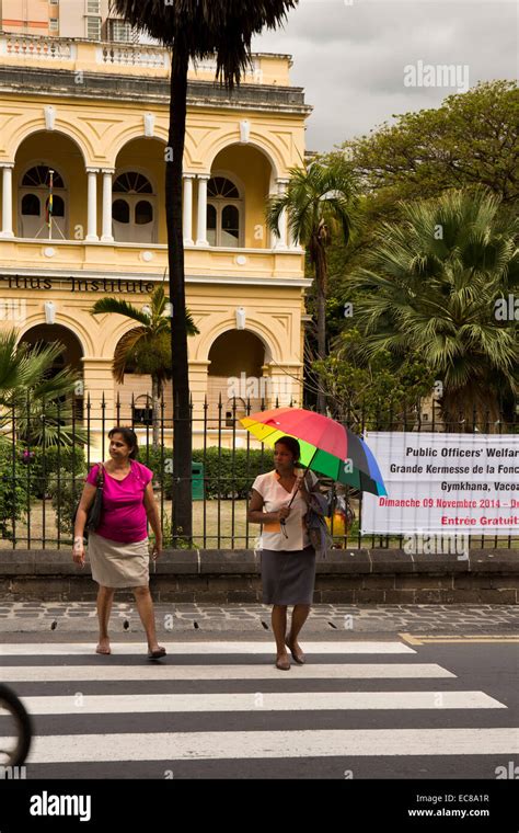 Mauritius, Port Louis, women crossing road on zebra crossing outside ...