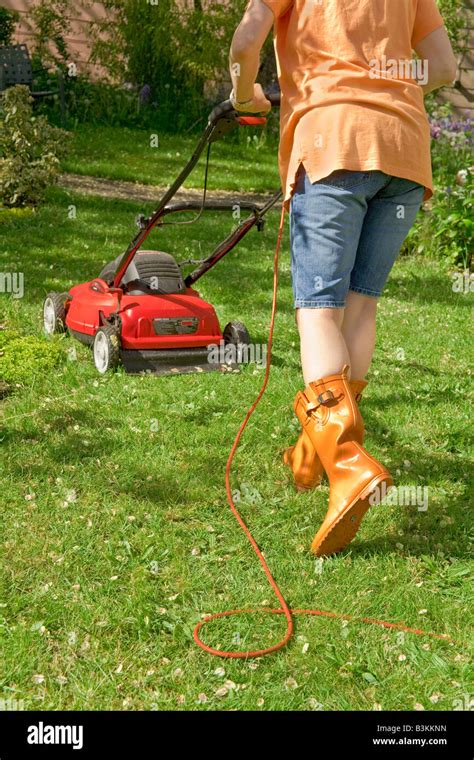 Mature Lady Mowing Lawn Hi Res Stock Photography And Images Alamy