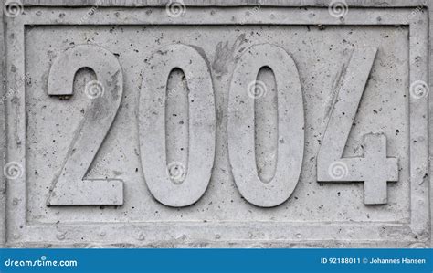 Concrete Block With The Year 2004 Engraved Stock Image Image Of