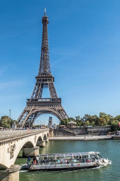 Premium Photo | View of the eiffel tower and seine with a boat