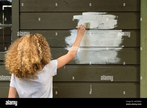 Girl Painting House Stock Photo Alamy