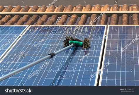 Cleaning Solar Panels On House Roof Stock Photo 733681873 | Shutterstock