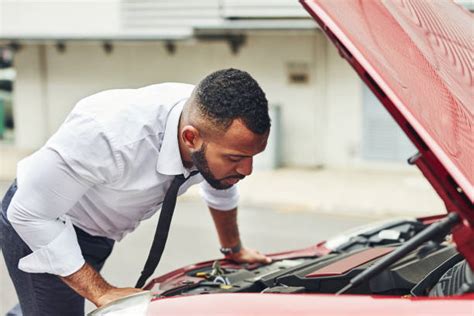 Man Looking Under The Hood Stock Photos Pictures And Royalty Free Images