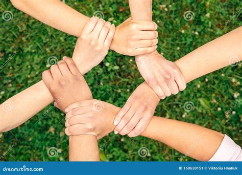 Volunteering Young People Volunteers Outdoors Together Holding Hands