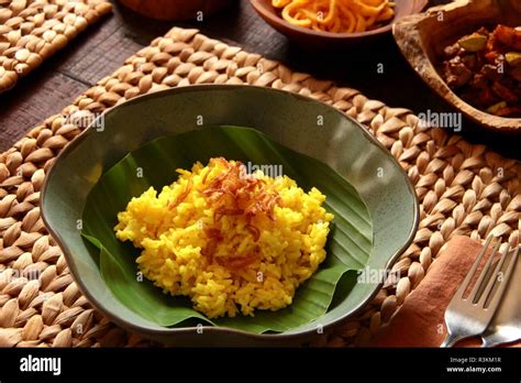 Nasi Kuning Traditional Indonesian Yellow Turmeric Rice Accompanied