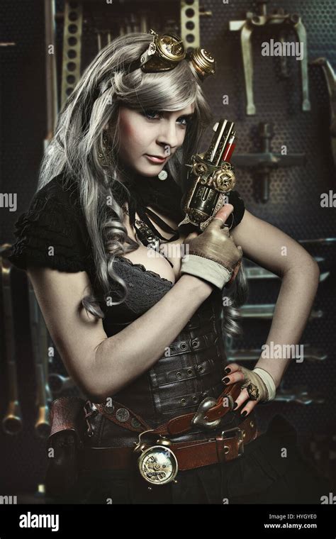 Portrait Of Steampunk Woman With Gun Mechanical Background Stock Photo