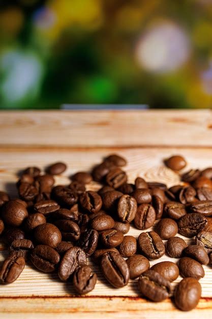 Premium Photo Coffee Beans Piled Up All Over The Table Coffee Beans