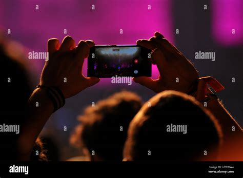 crowd  partying people    smartphone  electric