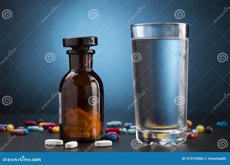 Pills Medicine Bottle and Glass of Drink Water Stock Photo - Image of lifestyle, cure: 57470400