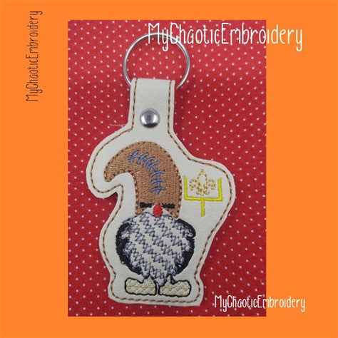 Fleur De Lis Football Snap Tab Embroidery Designs Football In The Hoop Key Fob Embroidery