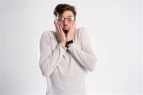 Premium Photo Man With Glasses With Shocked Amazed Expression