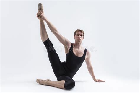 Active Caucasian Relaxed Ballerino Dancer Sitting While Practising