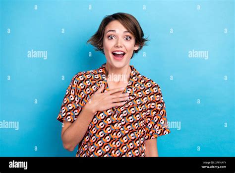 Portrait Of Astonished Cute Girl Open Mouth Arm Touch Chest Cant Believe Isolated On Blue Color