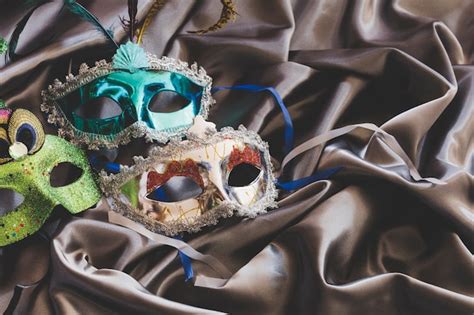 Free Photo | Arranged colorful masks on silk